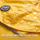 Dalmatian sitting in rain wearing yellow raincoat
