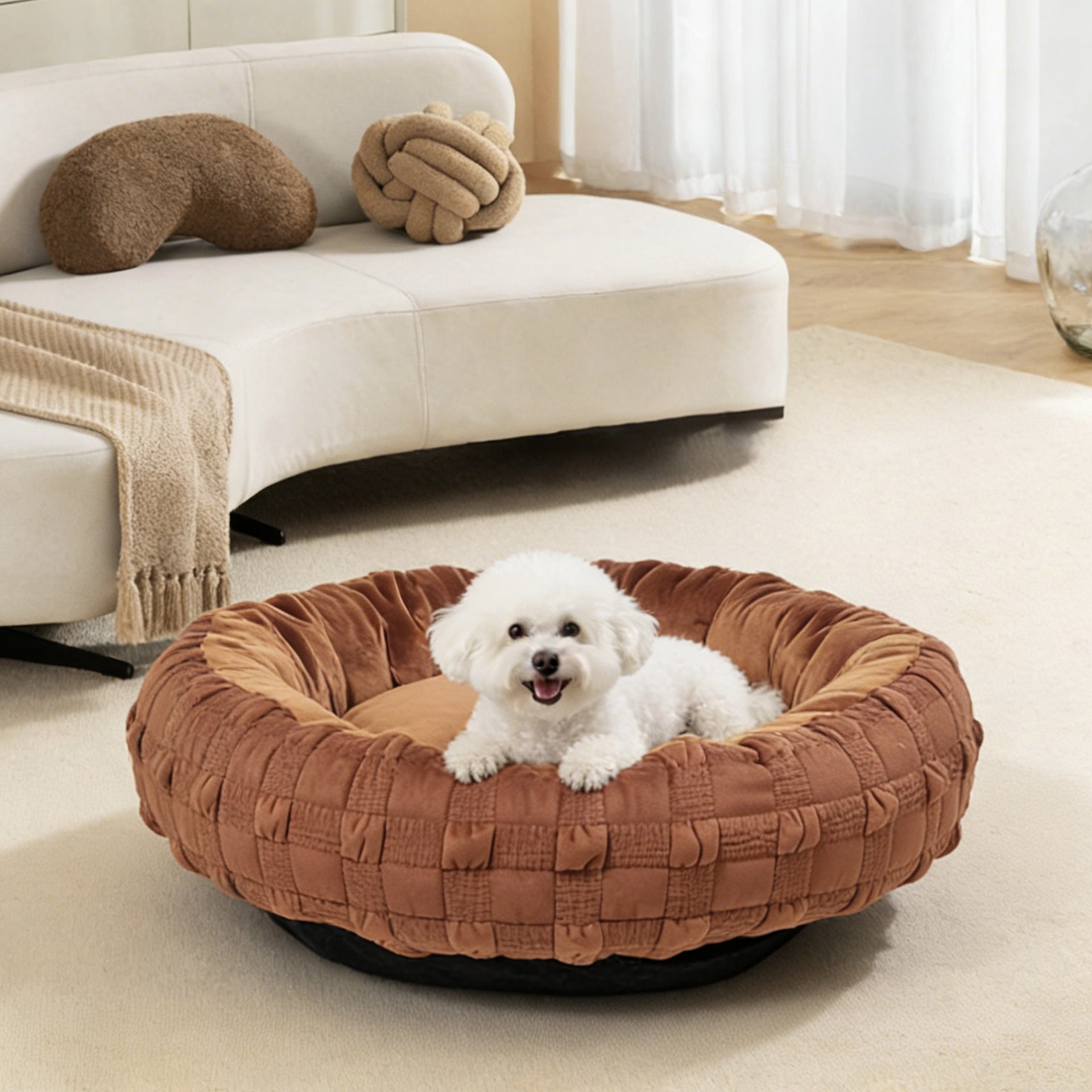 Woven donut dog bed in brown on a living room rug