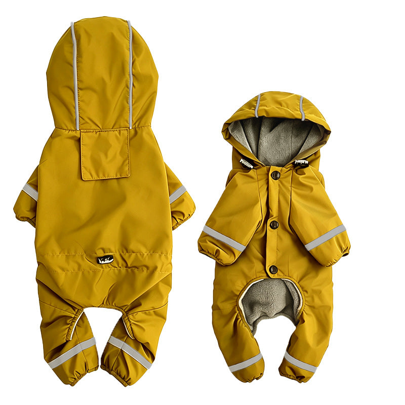 Miniature schnauzer wearing yellow fleece-lined hooded raincoat outdoors in the rain