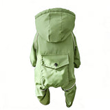Small white dog sleeping in khaki beige dog jumpsuit